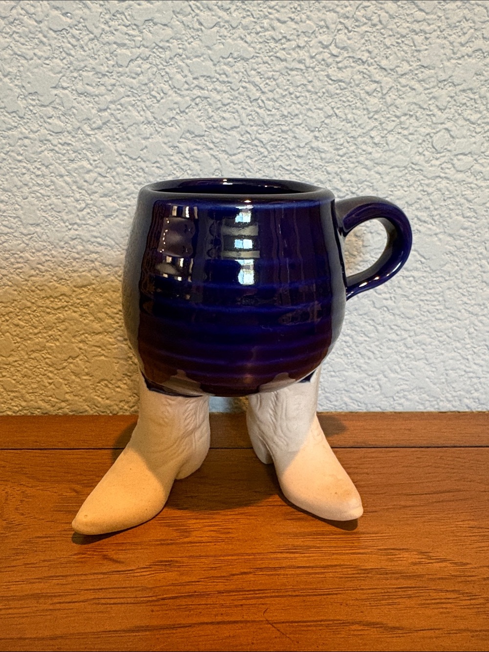 Vintage Five Bridges pottery cowboy boot coffee mug in blue. Stamped FBI USA.